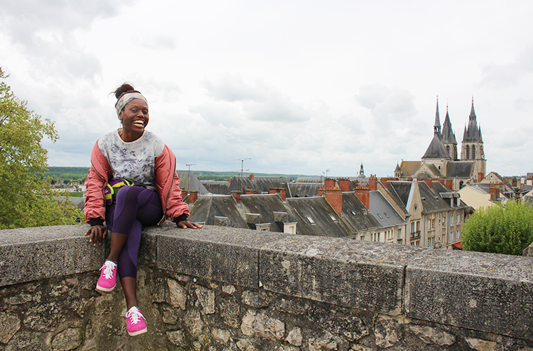 Melting Sisters - girl sitting with Blois, french castles of the loire valley in the background