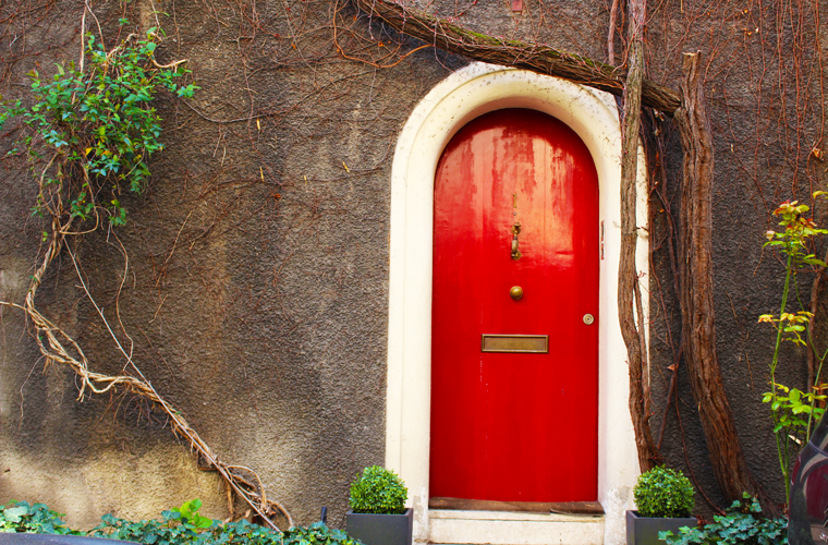 Little villages of Paris- a red door in the quaint square Montsouris