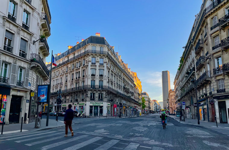 Snippets of a lockdown wonderland - Late afternoon light illuminates the Montparnasse tower and the end of an empty Rue de Rennes