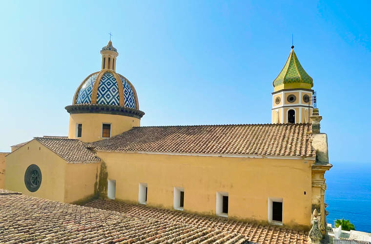 Solo road trip in Italy, The tiled dome and roof of Church of San Gennaro in Praiano on the Amalfi coast