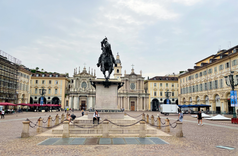 "Piazza San Carlo, Turin’s grandest central square. A rectangle with a statue of Duke Emanuele Filiberto at its centre and a twin pair of Baroque churches, Chiesa di San Carlo and Santa Christina on the southern side"