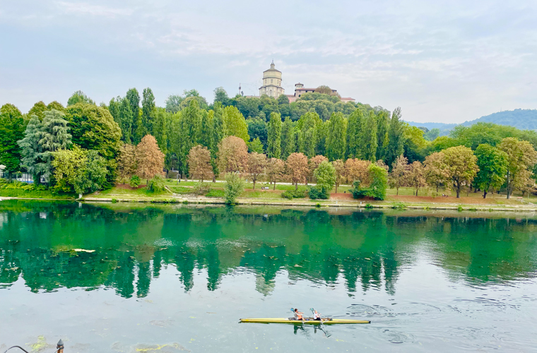 Canoeing on the River Po with the Chiesa al Monte dei Cappuccini in the background
