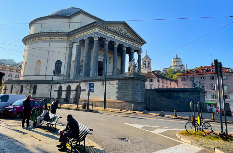 Locals enjoying the morning sun, Chiesa Gran Madre di Dio, east bank of the river Po on the other side of Ponte Vittorio Emanuele I